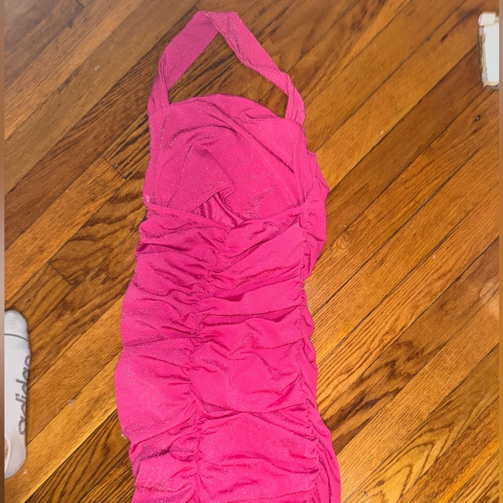 Hot pink sparkly bodycon halter dress.